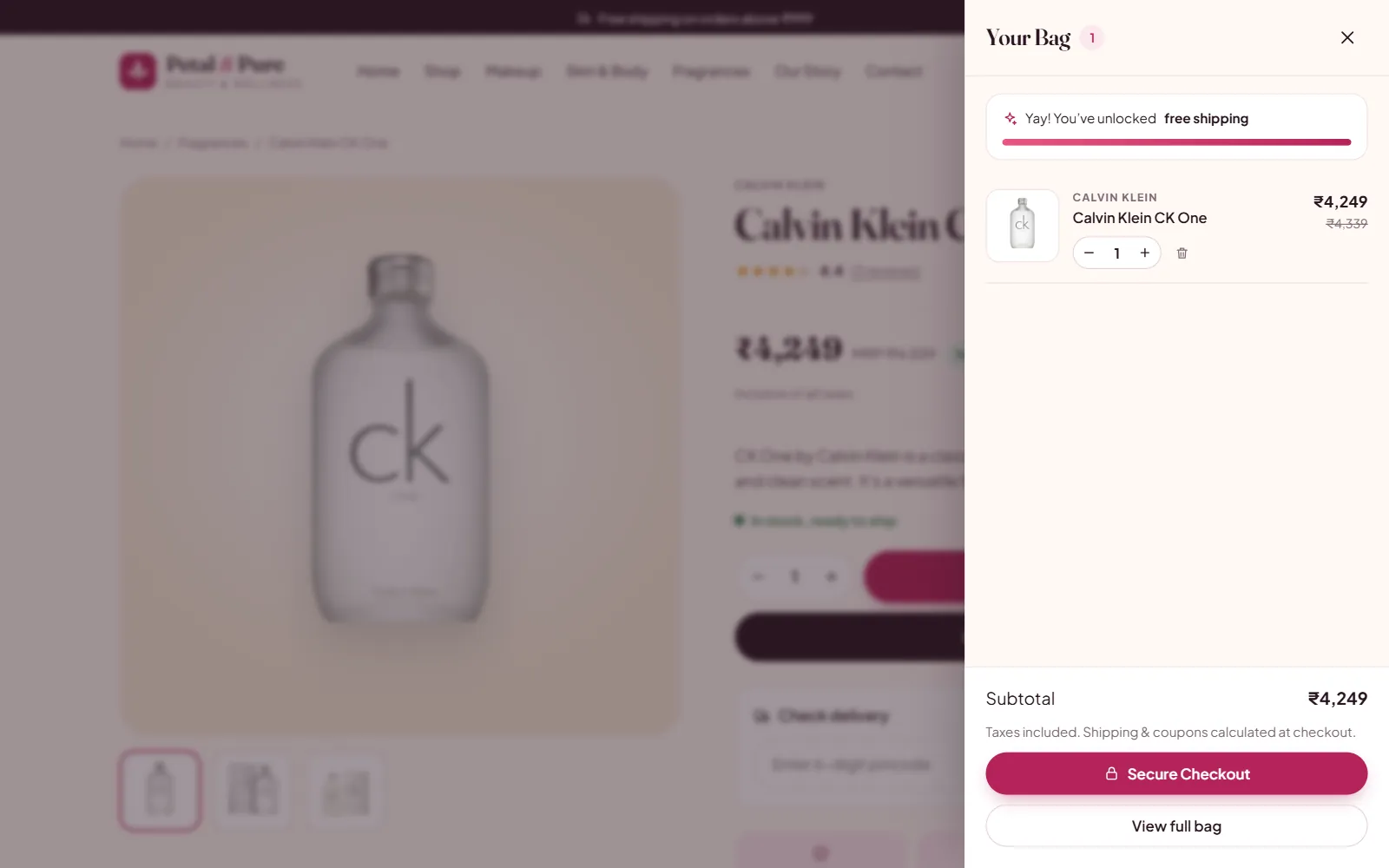 Slide-out shopping bag on a beauty store showing an unlocked free shipping progress bar, the chosen fragrance, quantity controls and Secure Checkout
